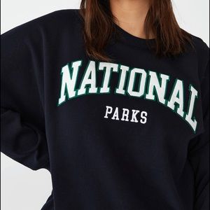 Black/navy sweater , titled national parks